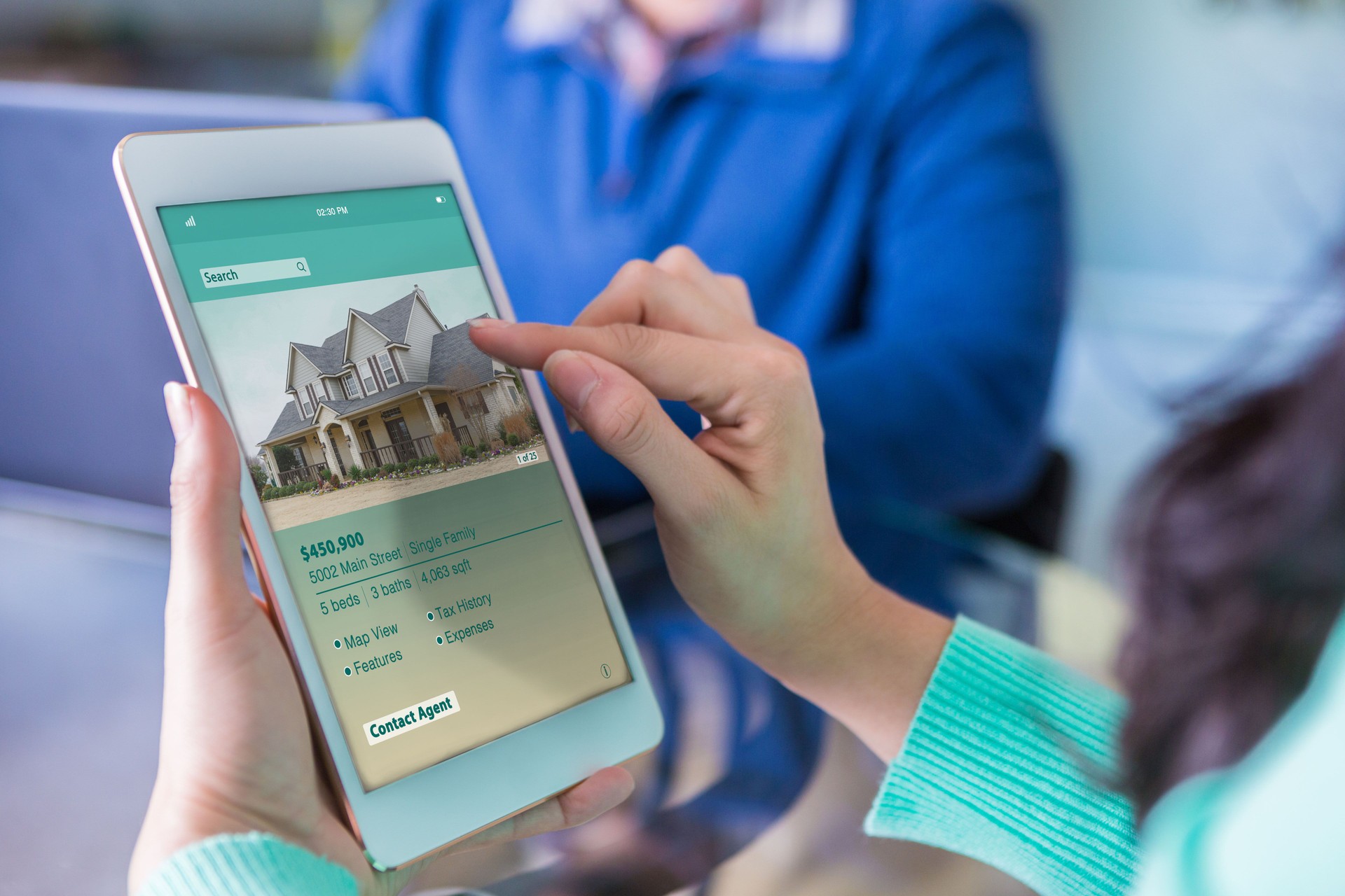 Closeup of tablet being used to shop for a home